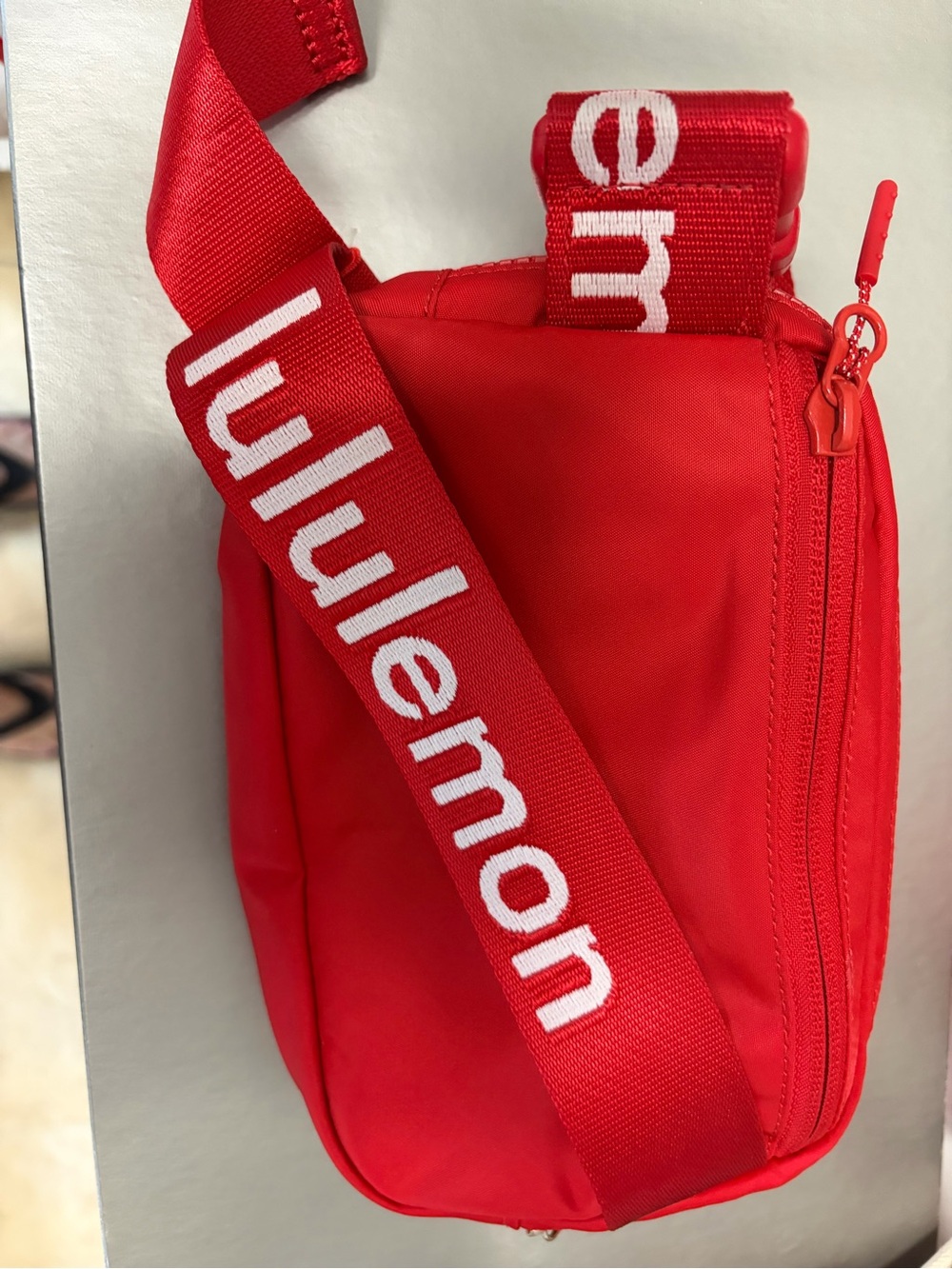 NWOT Lululemon educator 1 liter red belt bag with watermark. Never used.